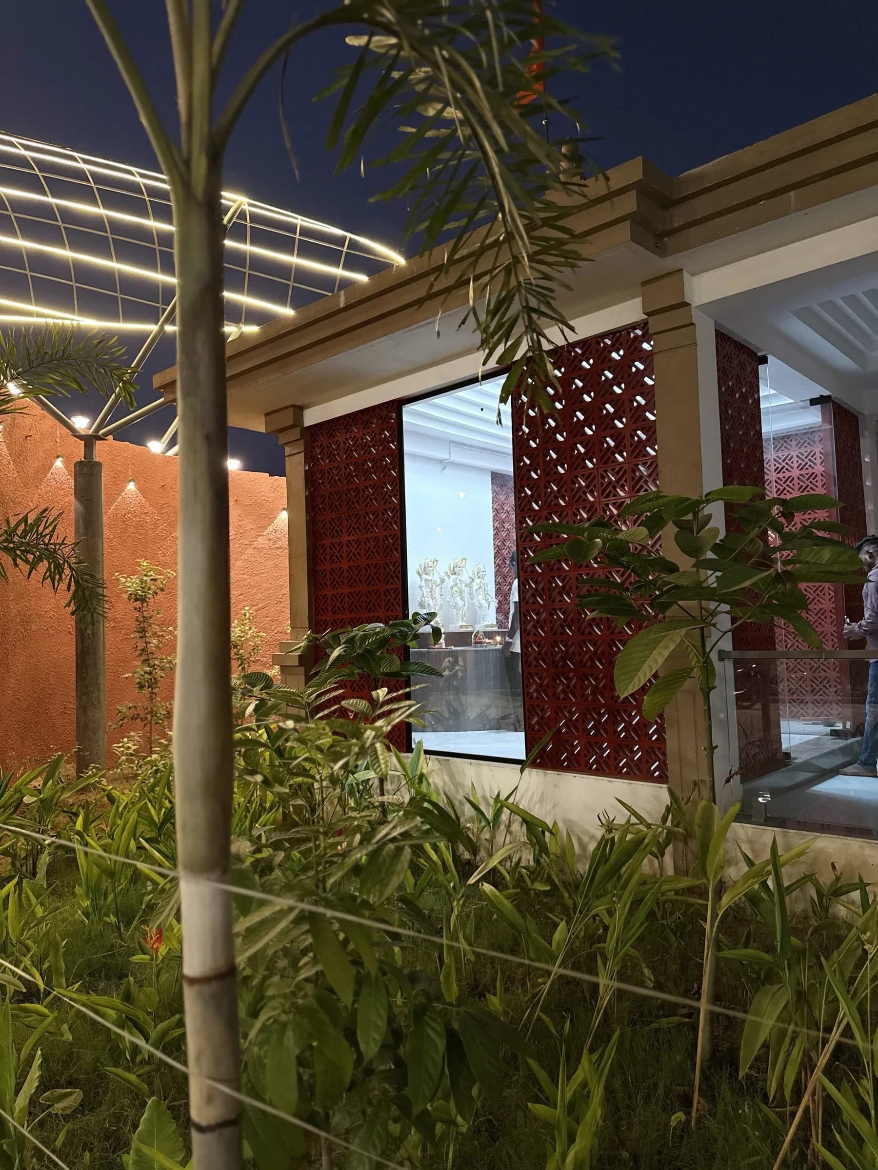 Jaali screens lit from within at night